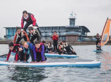 Children playing on paddle boards at ASC Portsmouth