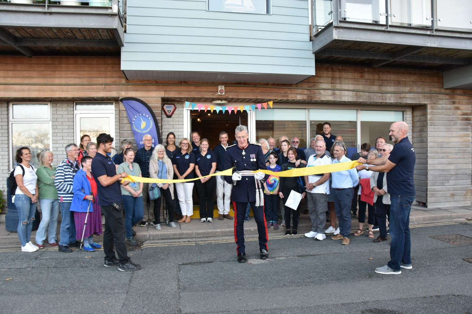 Cutting the ribbon for the new shore base at Horizons Plymouth with supporters watching happily